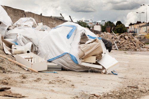 Technicians loading mixed waste onto a truck at a townhouse cleanout