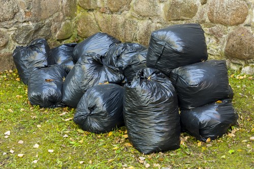 Residents separating recycling at street bins