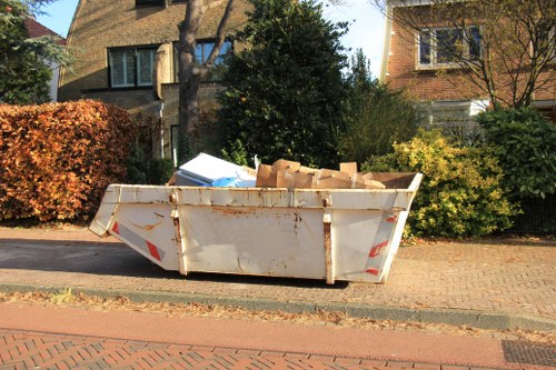 Professionals from Tomys Waste handling recycling materials
